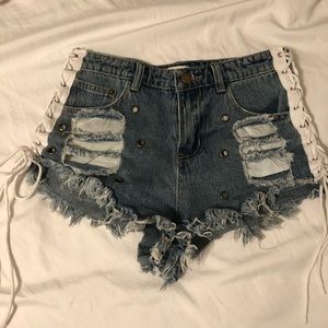 Lace up jean shorts with cute details.